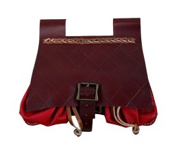 This well-crafted Medieval leather pouch is is actually three pouches in one – the divided compartments making it quite well suited for organizing ones coinage and necessities. The pouch is constructed from stitched, quality leather dyed in varying brown and red hues.
The main pouch flap is secured with an adjustable strap and antiqued brass buckle; the two smaller pouches are closed with an integrated clasp cord. An integrated belt loop is atop to knotted cord which allows this pouch to either hang from a thin belt, or to be laced through with a cord and then hung onto a thicker belt.