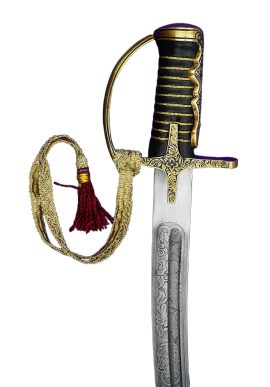 This reproduction of an Polish 18th Century Hussar Saber / Szabla has a blade forged from tempered EN45 high carbon steel which is lavishly etched and embellished on both sides in scrollwork filigree; on one side of the blade is etched Hussaria and upon the other it is etched with Jesus Maria Josef Spes Mea (Jesus, Mary and Joseph are my my hope).
The hilt is fashioned from finely cast antiqued brass and its grip is wood with a wrap of leather and inlaid twisted brass wire. One side of the guard has a thumb ring to ensure the safe and secure placement of the thumb against the guard for greater control of the blade. A sword knot with a band of woven cloth and a tassel completes the sword.
The saber comes with a scabbard of steel with an integrated hanging ring.