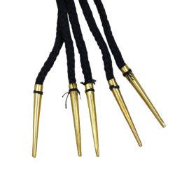 These brass aiglets are sewn to long black cotton cords and are ready to be used with arming doublets, gambesons and other period garments.