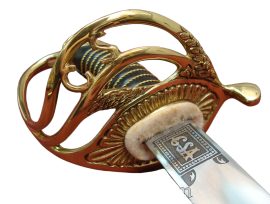 The Confederate Cavalry Officer Saber features a hand forged high carbon steel blade with acid etched C.S.A. designs. The guard and pommel are solid brass, while the wood grip is wrapped in leather and brass wire. The matching scabbard is made of blued steel, with brass throats, mounts, rings and drag.