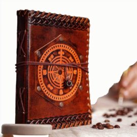 
With our gorgeous handmade leather journal with an embossed navigation compass, you can write anytime you want and anywhere you want – its a fantastic way to complete your character or ensemble, a logbook for your vessel, or simply a unique and idyllic place to pen your thoughts, schemes or
This journal has been handmade from robust genuine buff leather. What makes this journal stand out from the rest is its set of high quality 78 antique deckle edge papers, bound firmly using sturdy cotton strings. Its dimensions are approx. (7 X 5) inches.
