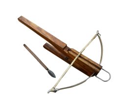 This decorative miniature crossbow is a fine desk adornment; or a serious upgrade to the local lawn gnome. Although the crossbow has working, moveable parts it is not practical for actual use. The crossbow is carved from wood and fitted with a steel prod with a bowstring. It comes with a trio of quarrels crafted from wood with a blackened steel heads.
Please Note: Only one crossbow bolt is pictured, though three are actually included.