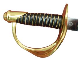 The 1860 Light Cavalry Saber was a copy of an earlier French issue saber and was manufactured in the North and in Europe for the Union forces.
Features a tempered carbon steel blade, solid brass guard & pommel, and a wood grip wrapped in leather and brass wire. Includes a steel scabbard with hanging rings.