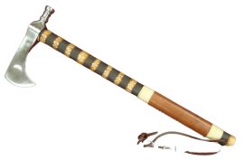 The Half Moon Tomahawk features an unsharpened head of solid high carbon steel, while the hardwood shaft is decorated with steel tacks, burn rings and a leather grip.