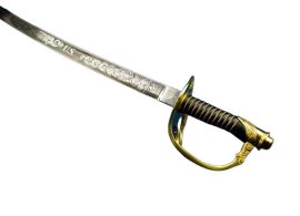 The Model 1860 Union Cavalry Officer Saber features a hand forged, British military spec, carbon steel blade that will flex over 20 and return to true. The leather handle is wire wrapped. The brass, 3-branch guard is nicely hand chased and engraved, as is the brass pommel. Blade is beautifully etched with ”U.S.,” and ”E Pluribus Unum,” along with foliage and military trophies. Steel scabbard has brass throat, rings and drag.