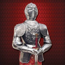 The Carlos V Suit of Armor is a full-sized replica suit of 16th century Spanish armour, reproduced based on the ones that belonged to Charles V and Philip II, which today are a part of the collection of the Real Armeria in Madrid. The armor, each piece being meticulously handcrafted, has been made in polished steel and iron, characterized by exquisitely etched elaborate floral figures etched on the largest part of its surface. Provided with an arabesque fabric gown and sword with velvet wrapped hand grip, the armor is atop a solid 22" x 22" wooden platform reinforced with metallic angles. A space in the helm is left open, allowing for ornamental ostrich feathers to be inserted as decoration.
This medieval knights suit of armor is an exceptionable symbol of historic and noble times that can be adapted to any interior decor. Handcrafted in Toledo, Spain, the suits of armor by Martespa, a division of Marto, are the best replicas you can find. Their unrivaled quality and historical authenticity makes them a valuable and impressive collector item!