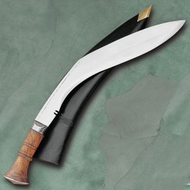 Since 1943 these Kukris have been made by one government contractor - Windlass Steelcrafts. The original, official military issue! Hand forged from high carbon steel, each comes with regulation sheath. A must for outdoor activities that require chopping and cutting.  This kukri beheads water buffaloes with a single stroke for the traditional Gurkha sacred ceremony. Very scarce! Only one is issued to each Gurkha Regiment in India. Specially carved native hardwood handle. The polished steel blade is a staggering 3/8" thick and more than 2-1/2 feet long. Made by Windlass Steelcrafts and comes factory sharp.
