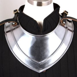 Adjustable two piece protection for the upper shoulders. Forged from 18 gauge steel and painted underneath to help with rust prevention (like all carbon steel, however, the exterior should be oiled to prevent oxidation). Adjustable leather straps for attachment and a second set of straps to attach pauldrons/shoulder armor. App. 2-1/2 lbs. Front piece measures 6" to tip.#300572