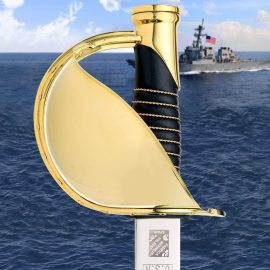 The new U.S. Navy CPO Cutlass was developed as a joint project with of the U.S. Naval Uniform Board. With three years in the making, it exceeds all specifications as required by the Board. Made with a Toledo Spanish steel blade and heavy gold plating, it exceeds the required specs and sets it apart from all other non-official versions in the market. Features 24K gold plate over solid brass pommel and guard with 11 gold plated rivets. The 26" blade has proper etchings with the traditional “French curve” shape, allowing the wearer to execute manual of arms. Premium leather wrapped grip with twisted gold wire strands. Includes matching scabbard with 24K gold plated throat and tip and a protective cloth bag.    Overall:  Blade: 26"  